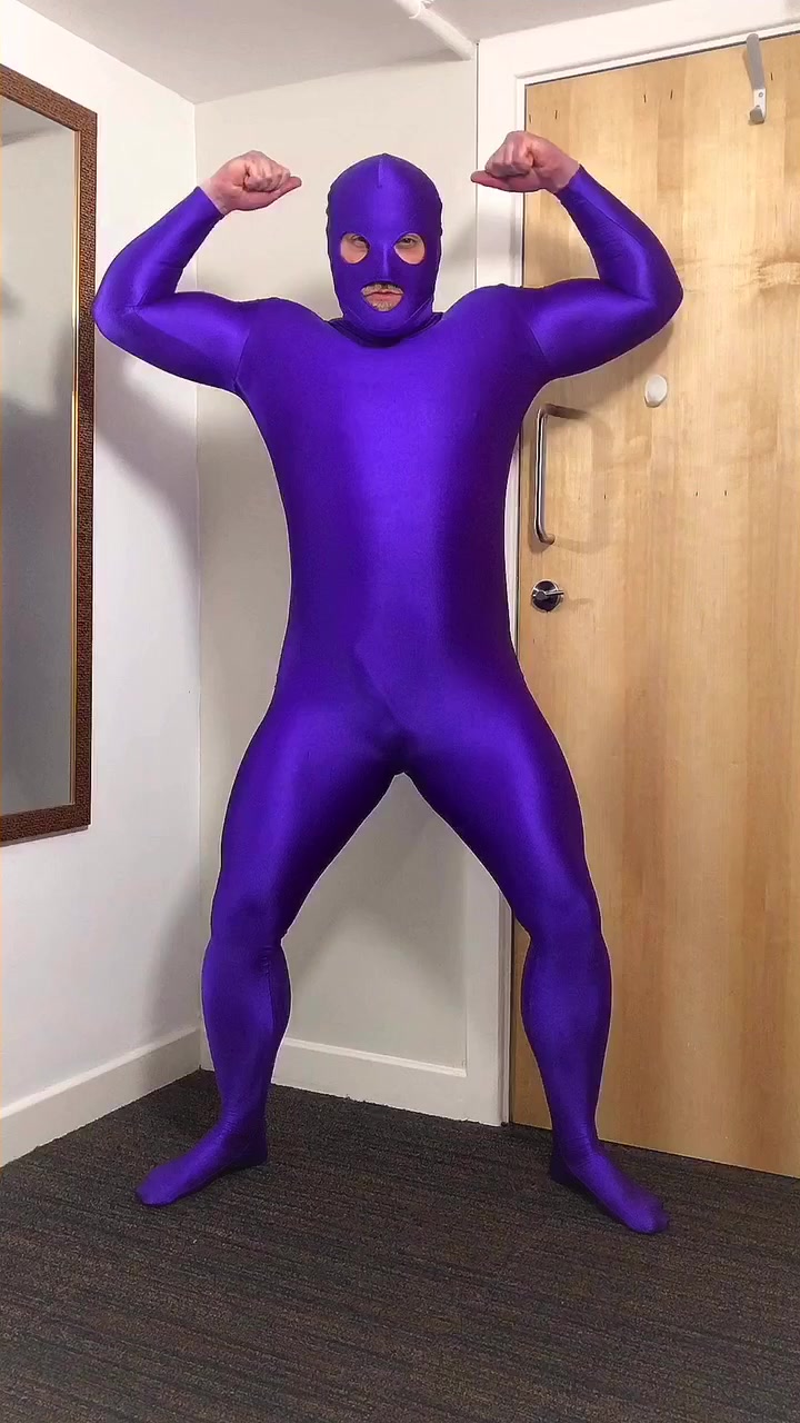 Muscle gym guy in purple lycra