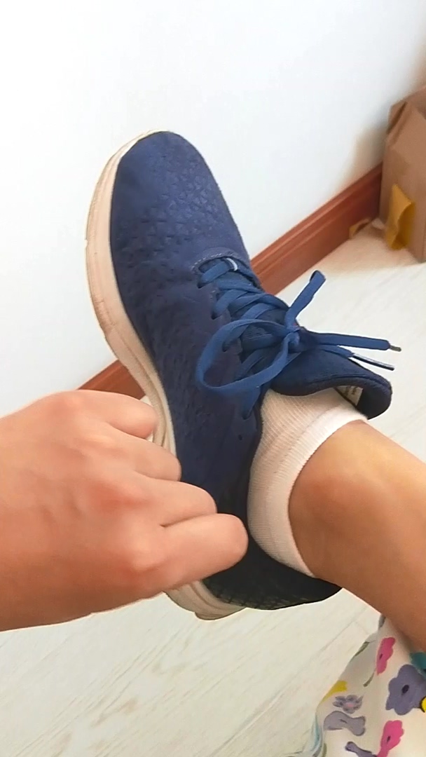 play with sleeping feet with blue sneakers