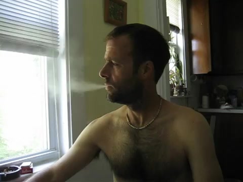 Shirtless hairy smoker