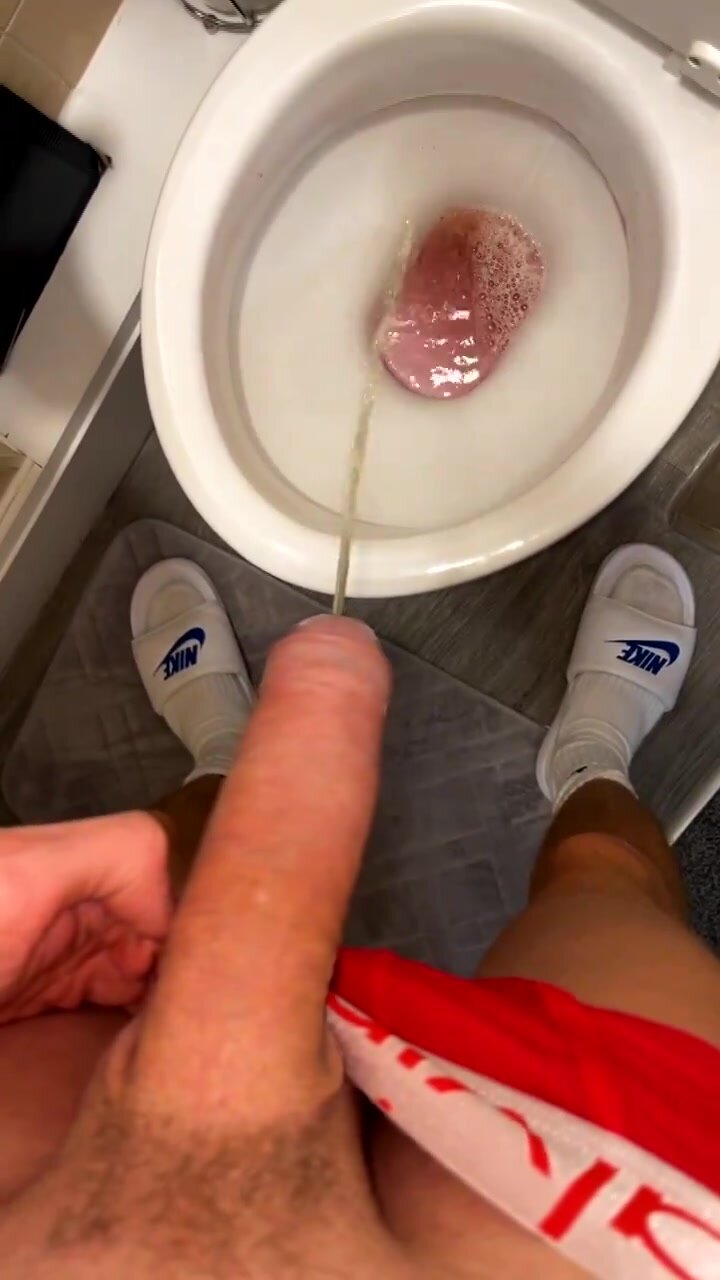 Lad pissing with Hard cock