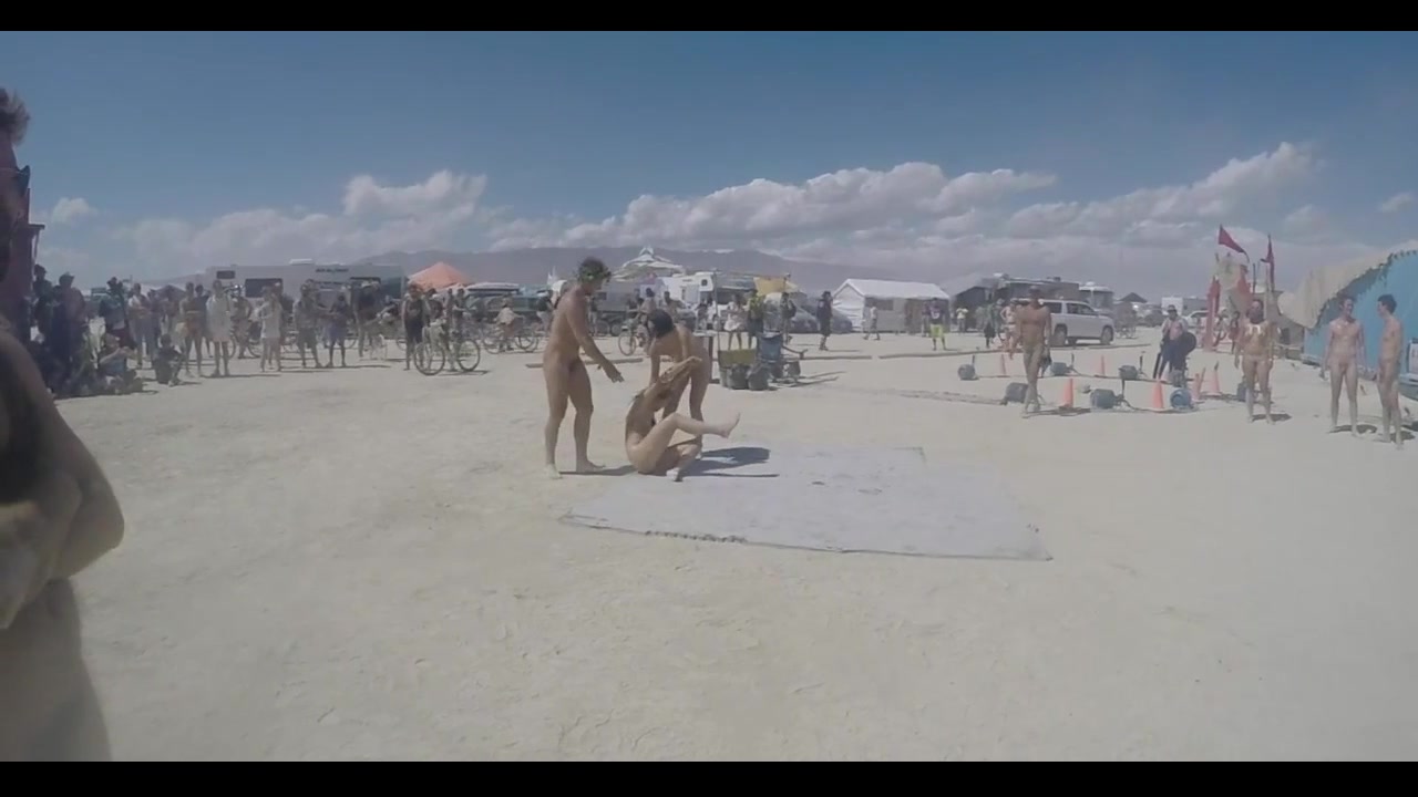 Naked male wrestling:  Burningman Festival