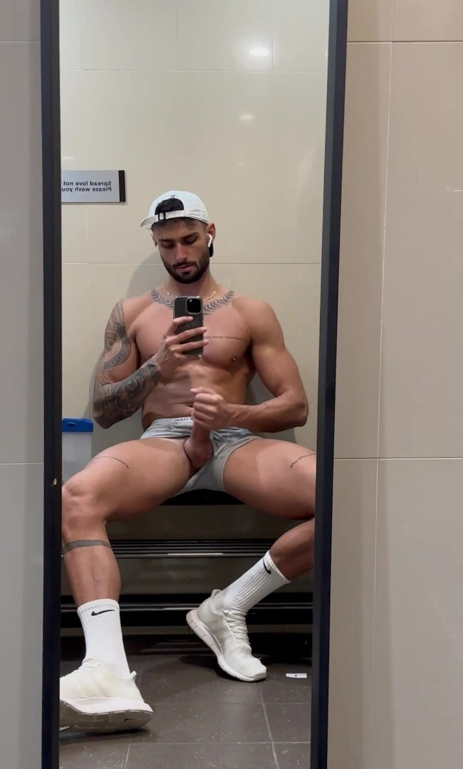 Tall muscular tan tatted greek god jerks off in lockers