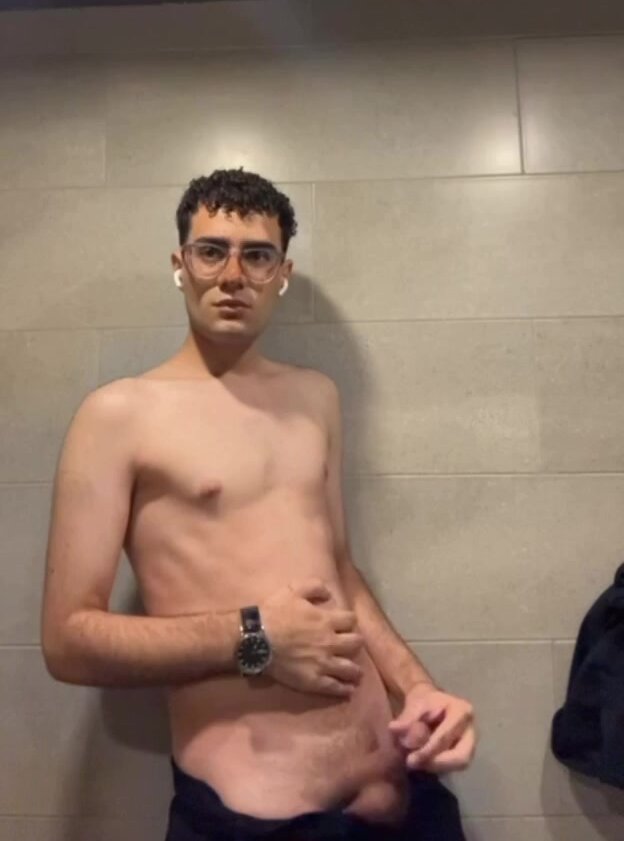 Small cock faggot jerks off in a public bathroom
