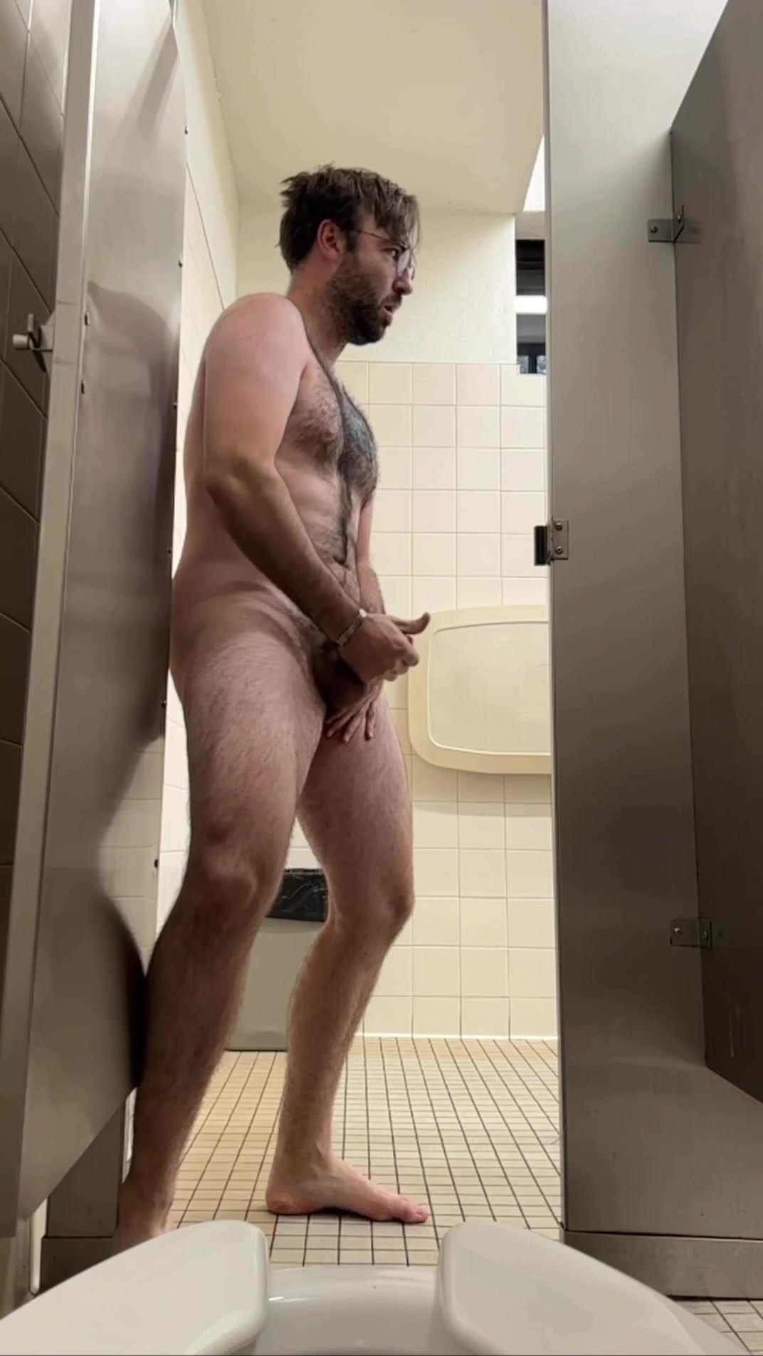 Horny otter faggot jerks off in a public restroom