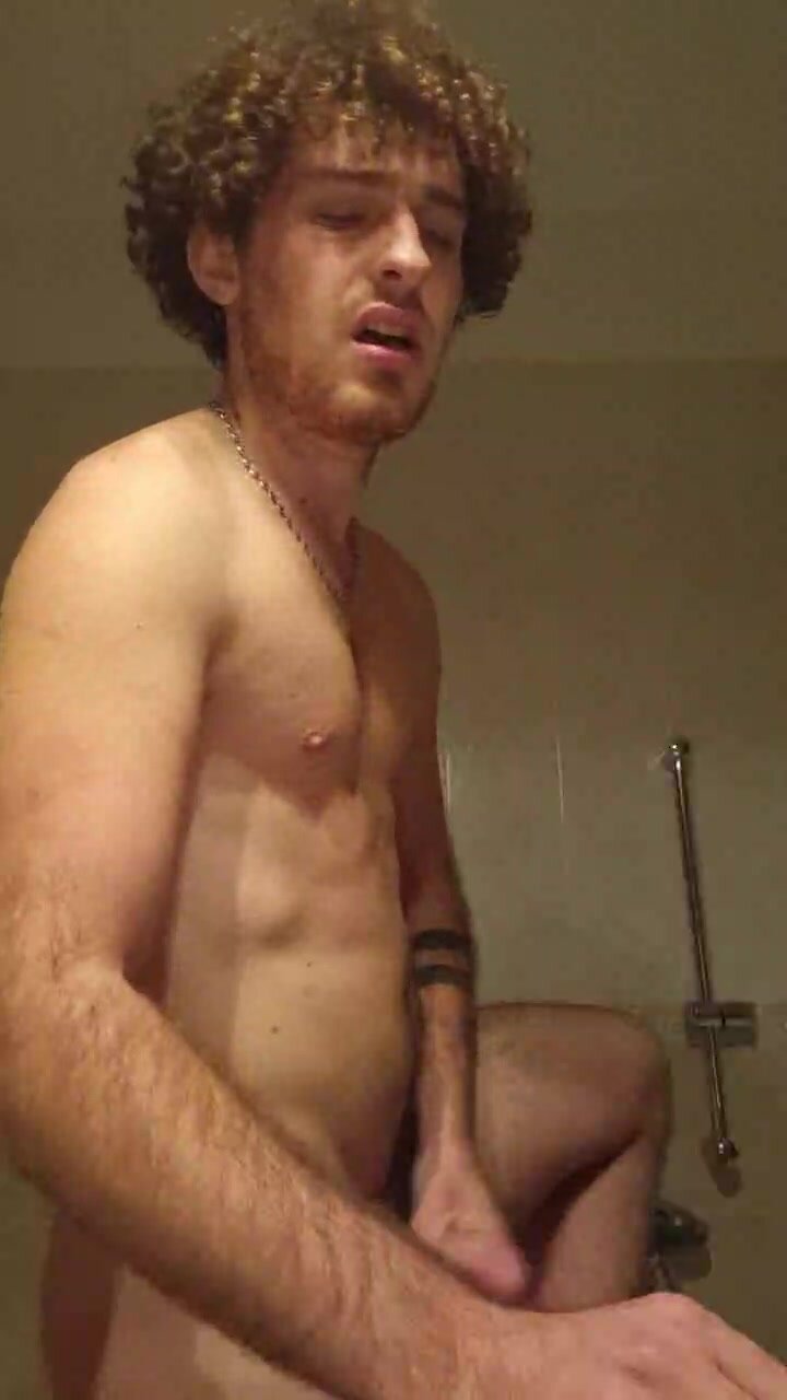Guy wanking his bushy cock