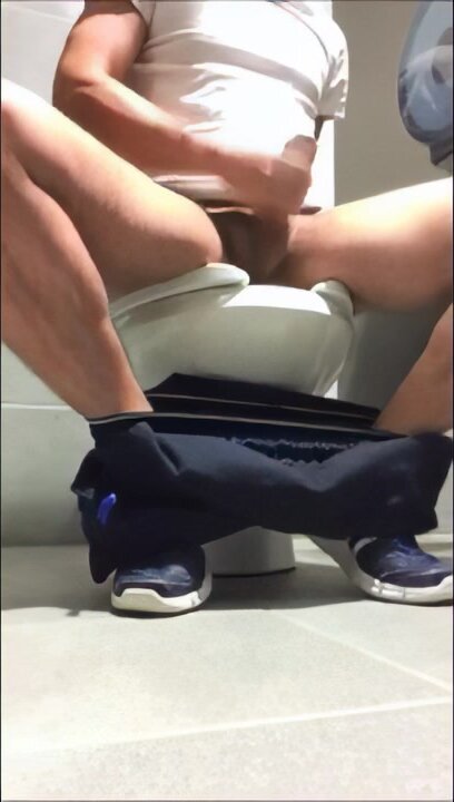 Giving His BiG rod some love while on the toilet
