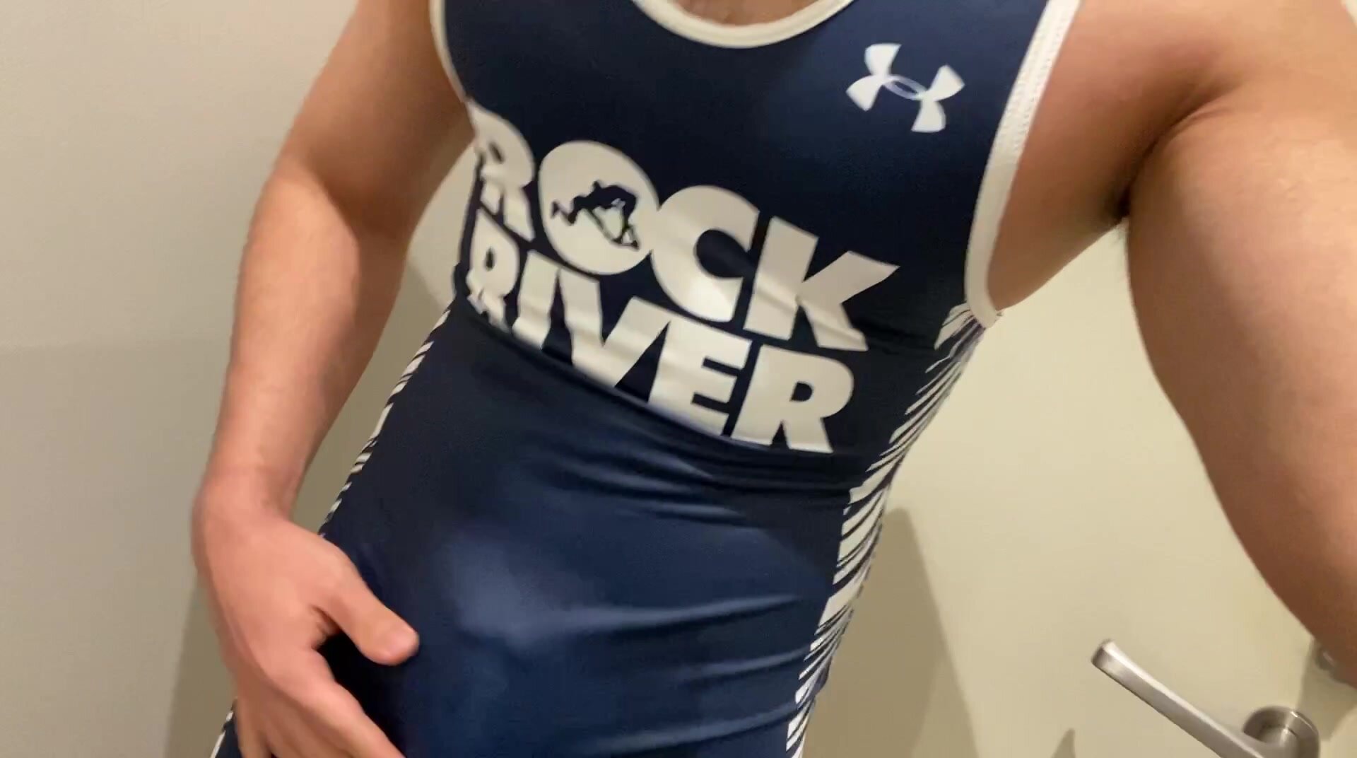 A guy celebrating after winning a wrestling competition