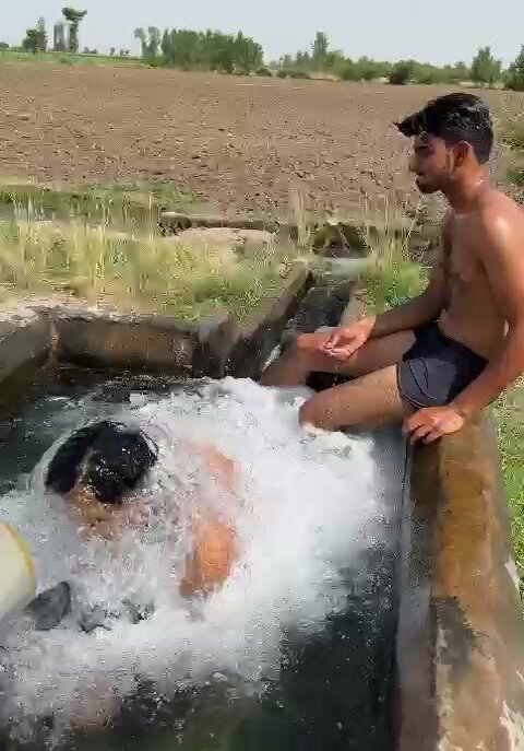 Tubewell boy taking a dip