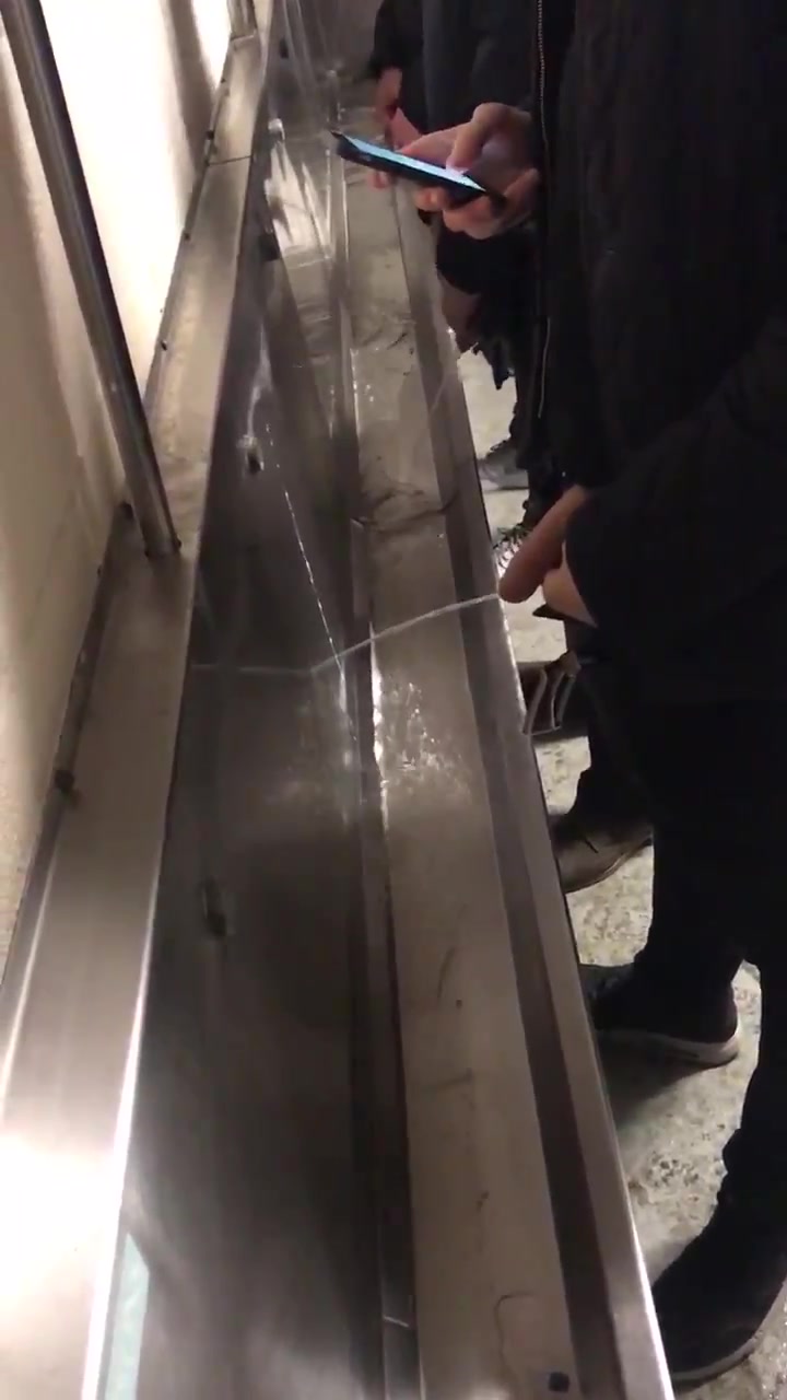 guy pissing urinal