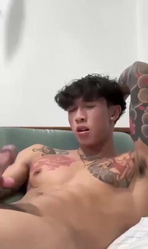 Tattooed young adult jerks off