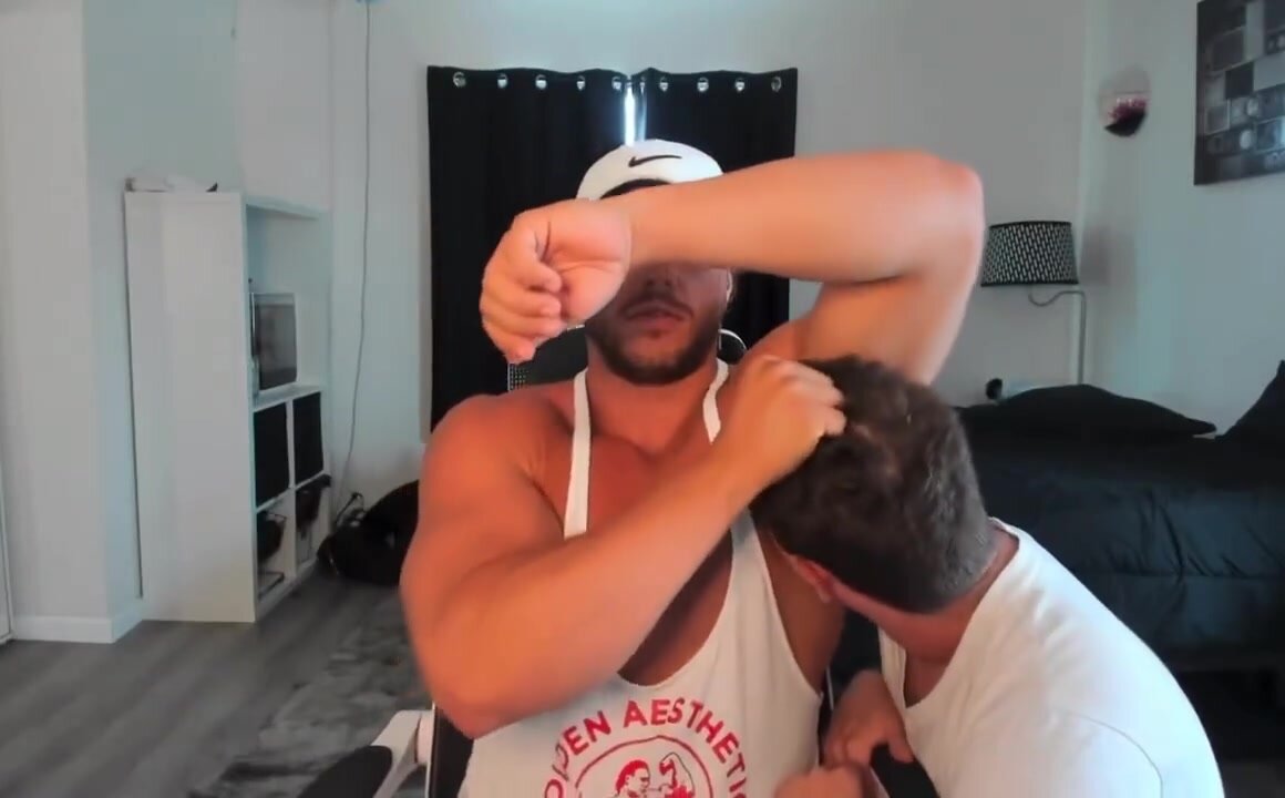 A slave licks his muscular master \