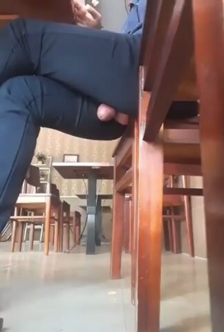 Man cums under table in public