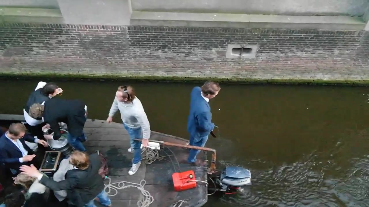 Guy peeing in Amsterdam canal