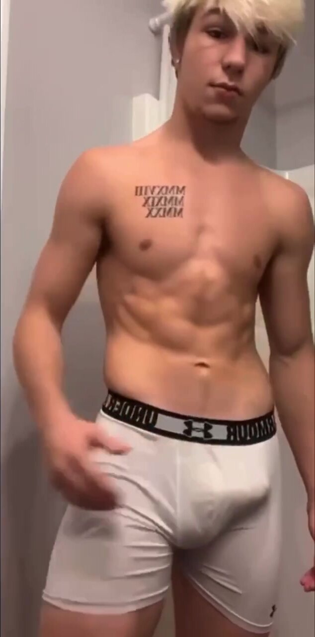 Young stud flexes cock through underwear