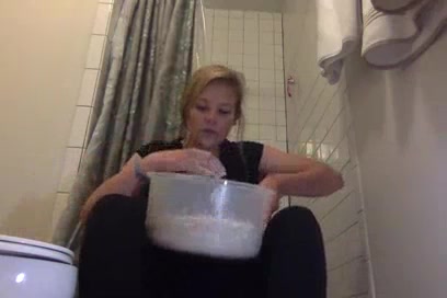 Gorgeous girl  pukes in a bowl and plays with it
