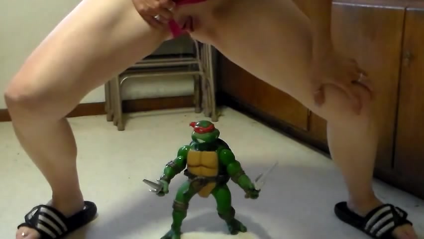 Girl pees on a ninja turtle
