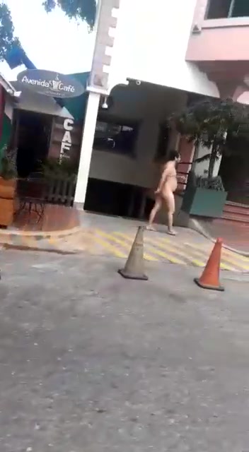 NUDE MAN WALKING ON THE STREET