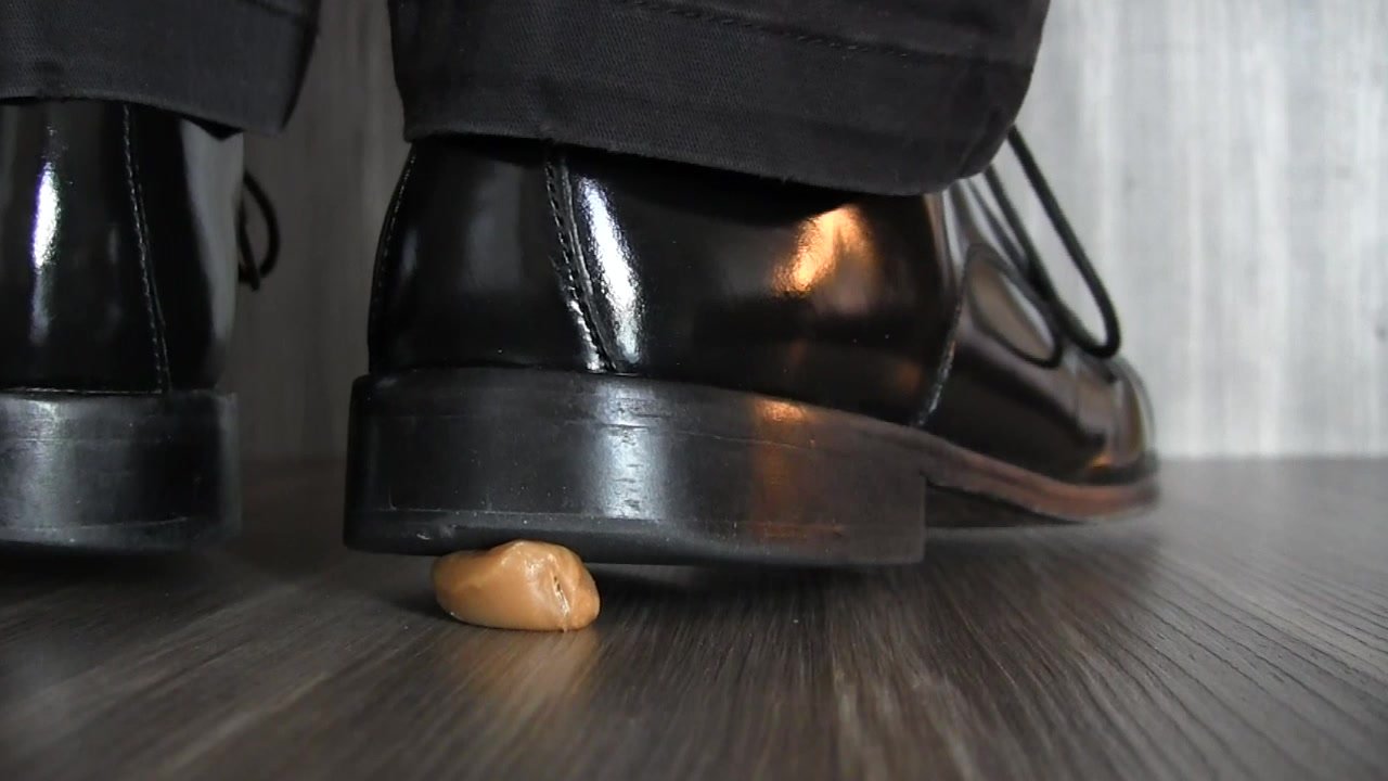 Slow oozing of caramel crushed under dress shoe heel