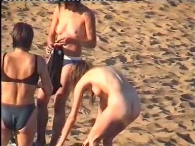 Sexy women changing clothes at the beach