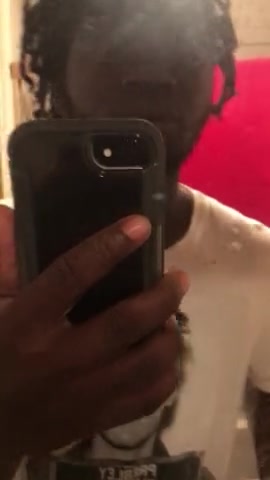 black guy spits on mirror