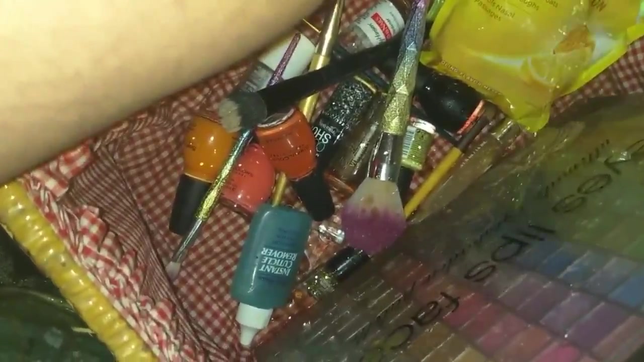 Girl pissing in bag with cosmetics