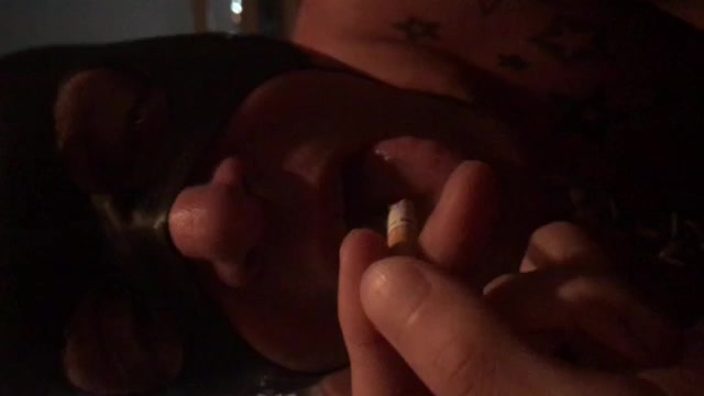 Ashtray boi putting off a cigarette on his tongue - video 4