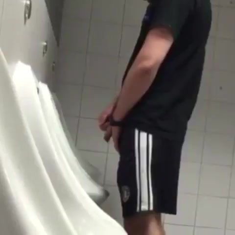 Guy in shorts pissing
