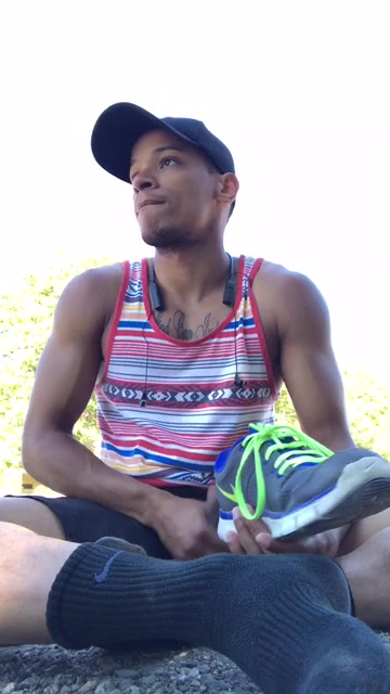 Hot black jock jerks off outdoors sniffing sneakers