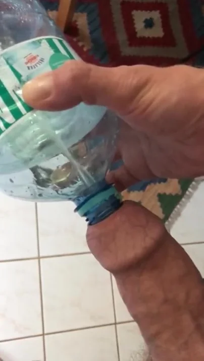 Uncut Hung Dude Pissing In Bottle