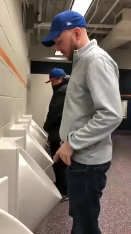piss and spit at urinal