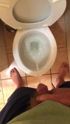 Man peeing in toilet