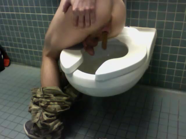 Hot young guy poops on toilet