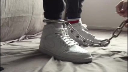 Boy wearing AJ1 shackled for the weekend