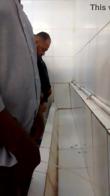Mens pissing together