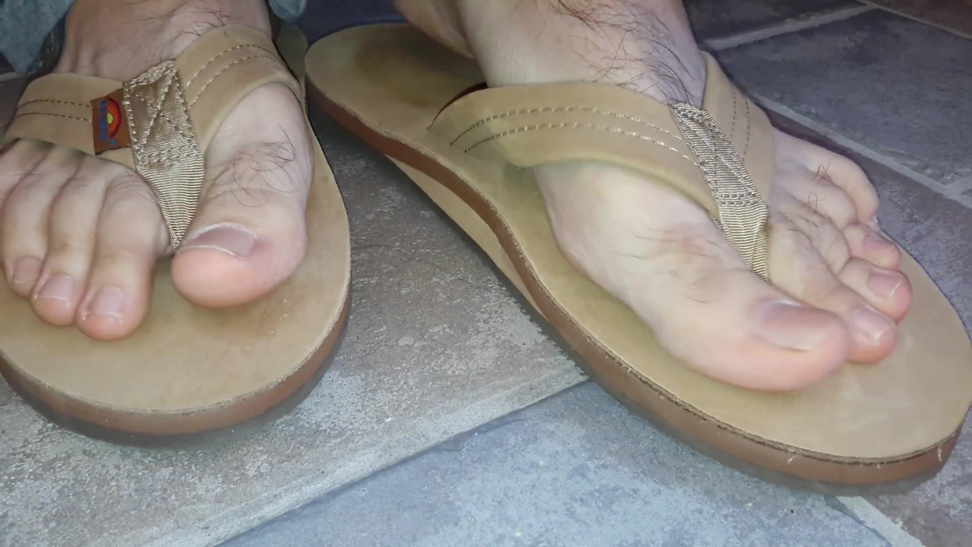 Male feet in flip flops - video 6