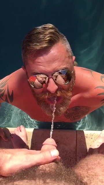 pissing in bearded guy's mouth