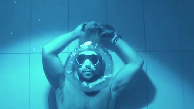 Swedish guy blowing air rings underwater
