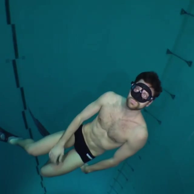 Luca Dotto breatholding underwater in speedos