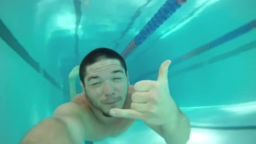 Diving underwater in the pool.
