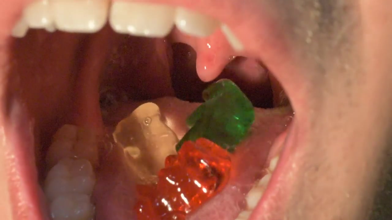 Guy swallows Gummy bears