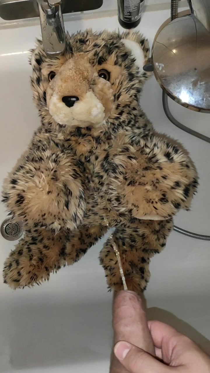 Peeing on cheetah plushie