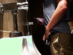 Big cock pissing at urinal