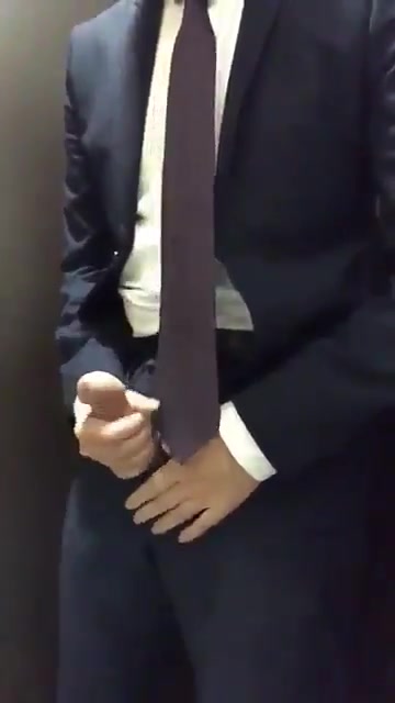 Suited pig busts a nut in stall