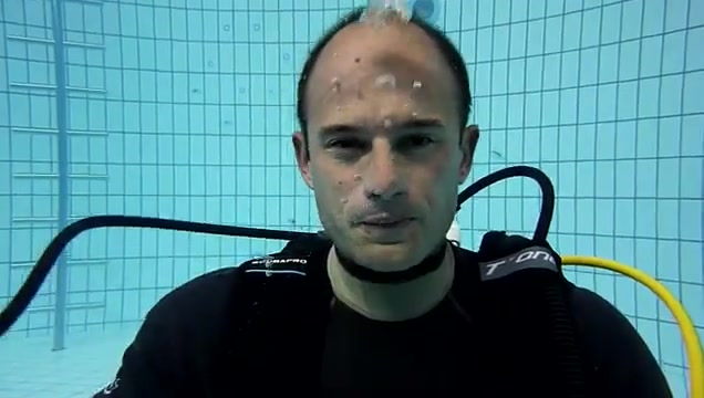Underwater barefaced scubadiver taking reg off - video 2