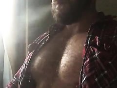 man with hairy chest smoking