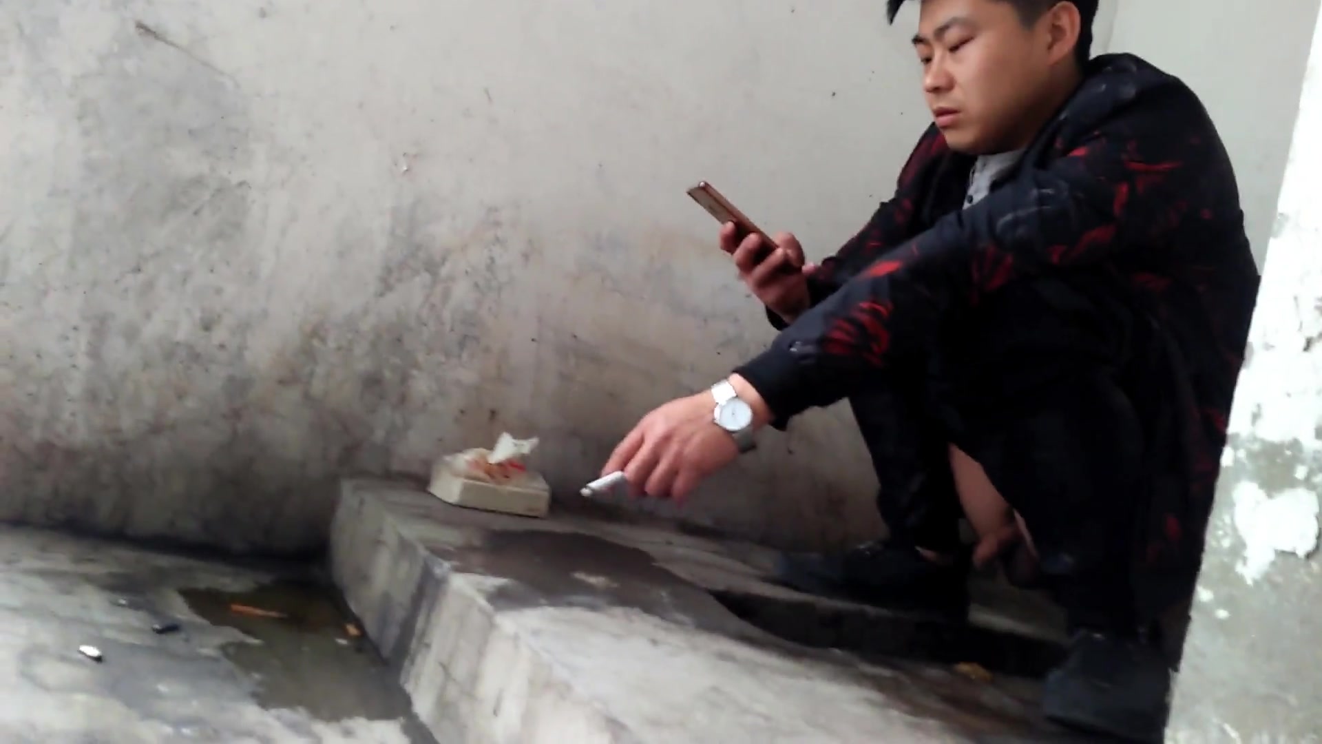 YOUNG CHINESE MEN AT THE TOILET