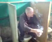 russian prisoner taking a shit