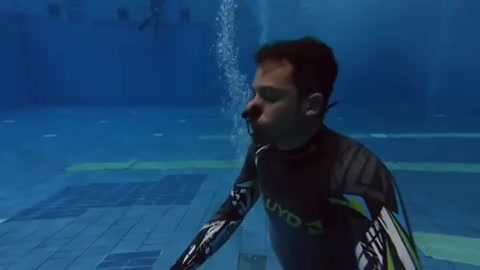 Barefaced hottie breatholding underwater in tight wetsuit - video 2