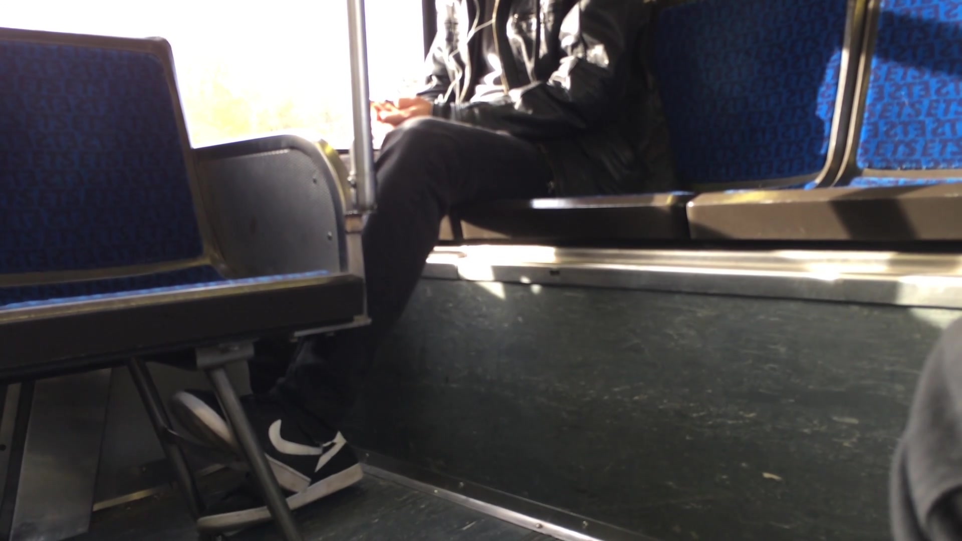Candid guy nikes on bus