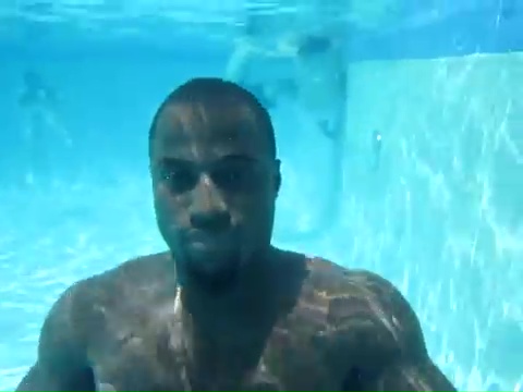 Sexy black men holding his breath underwater
